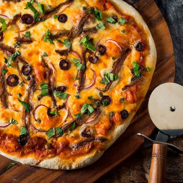 Pizza casera con anchoas. Foto: Bigstock Pizza casera con anchoas. Foto: Bigstock