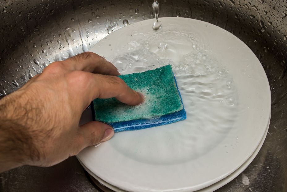 bigstock The Hand Washes The Dishes In452483589 bigstock The Hand Washes The Dishes In452483589