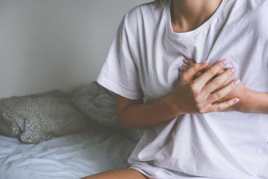 bigstock Woman Holding Chest Because Of 446825600 bigstock Woman Holding Chest Because Of 446825600