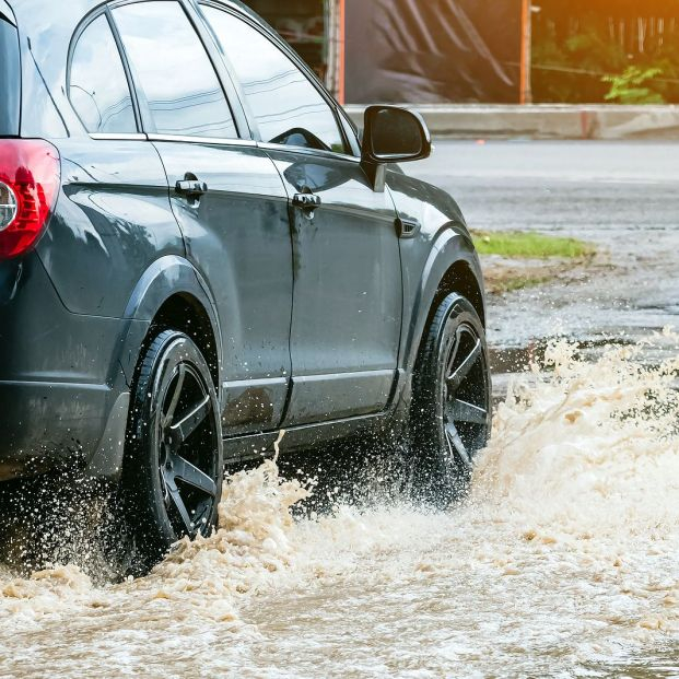 bigstock Car Passing Through A Flooded462472741