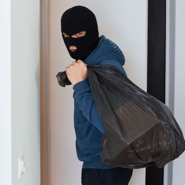 bigstock The Thief Holds A Bag Of Stole 441002411 bigstock The Thief Holds A Bag Of Stole 441002411