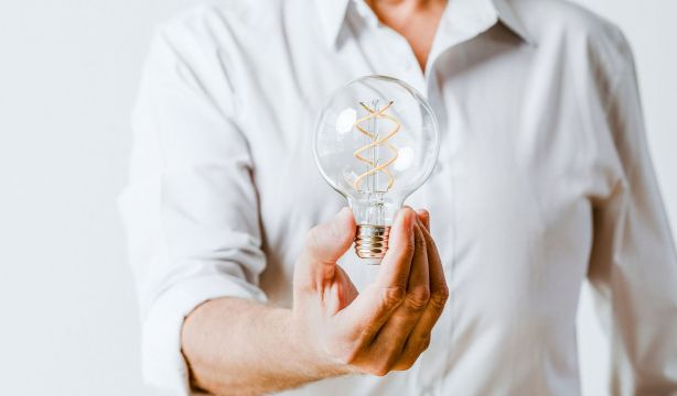 bigstock Creative man holding a light b 420219361 (1)