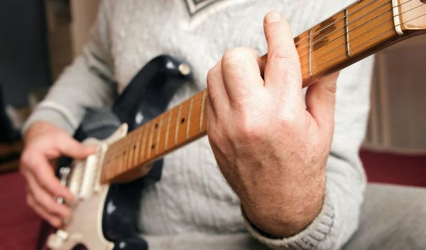 bigstock Senior Man Is Playing Guitar  473173099
