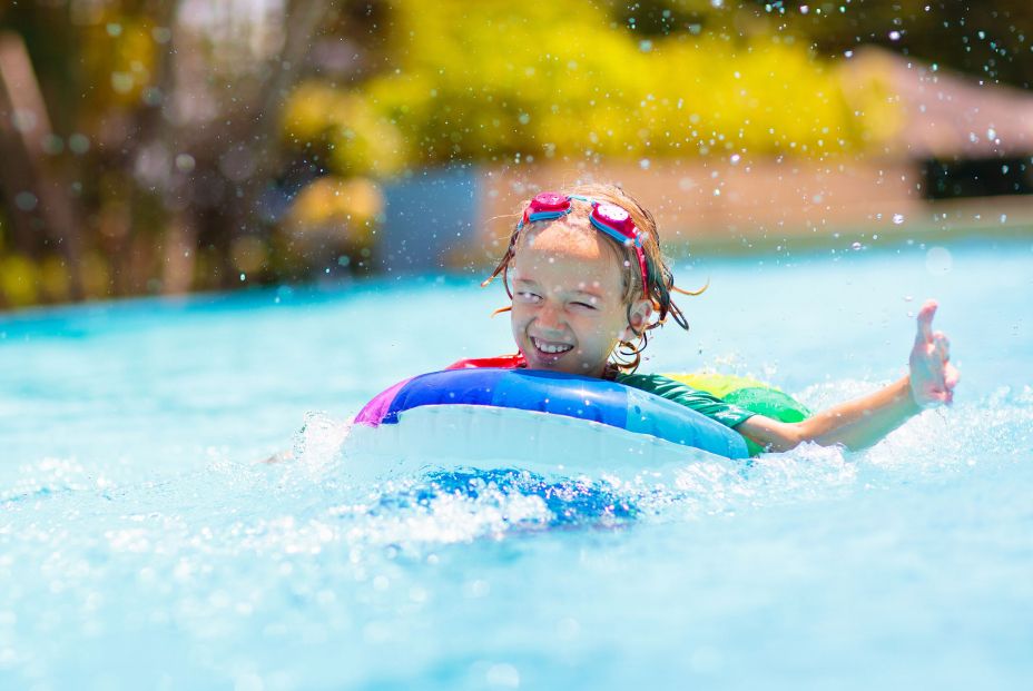 bigstock Child In Swimming Pool On Toy477974965