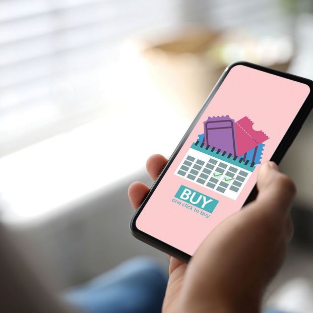 bigstock Woman Buying Tickets Online Vi 476751975