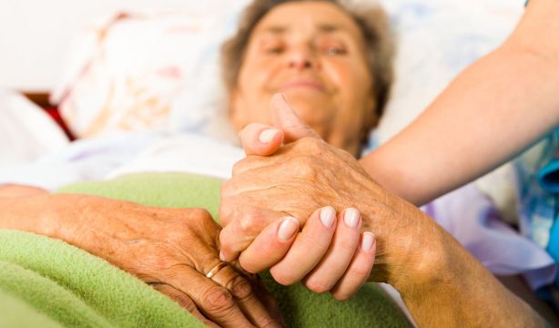 bigstock Caring Nurse Holding Hands 94724246