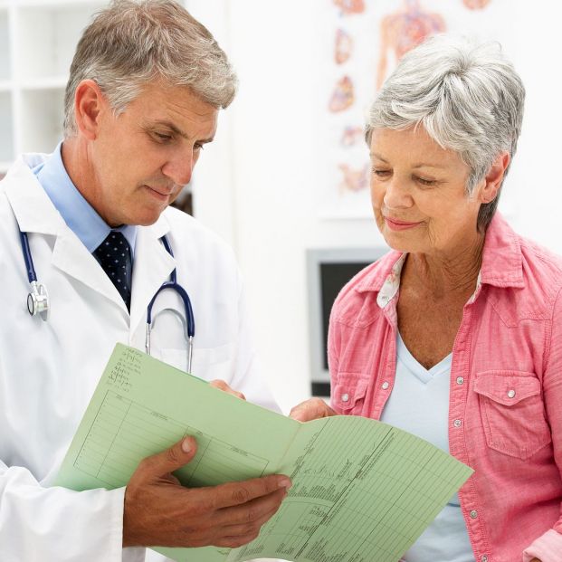bigstock Doctor with female patient 21258452