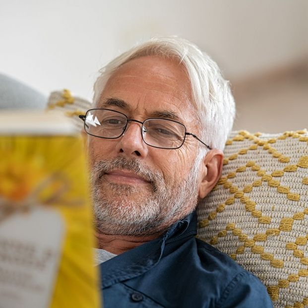 bigstock Happy mature man reading a boo 363994552 bigstock Happy mature man reading a boo 363994552