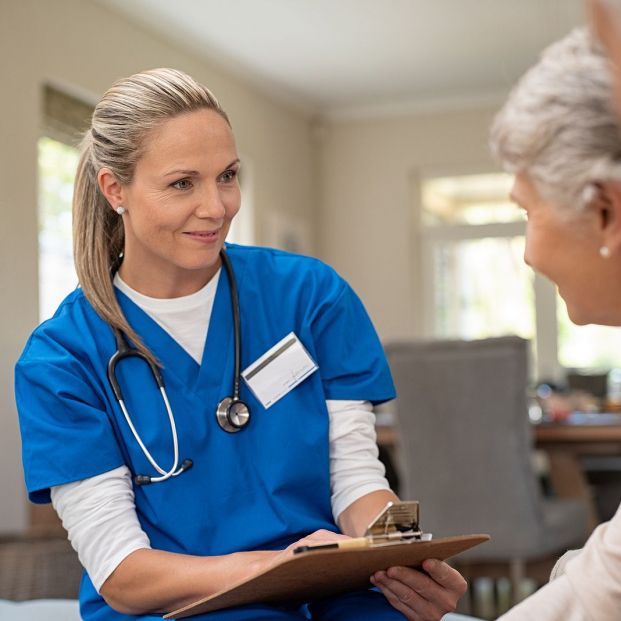bigstock Happy nurse talking to senior269124460