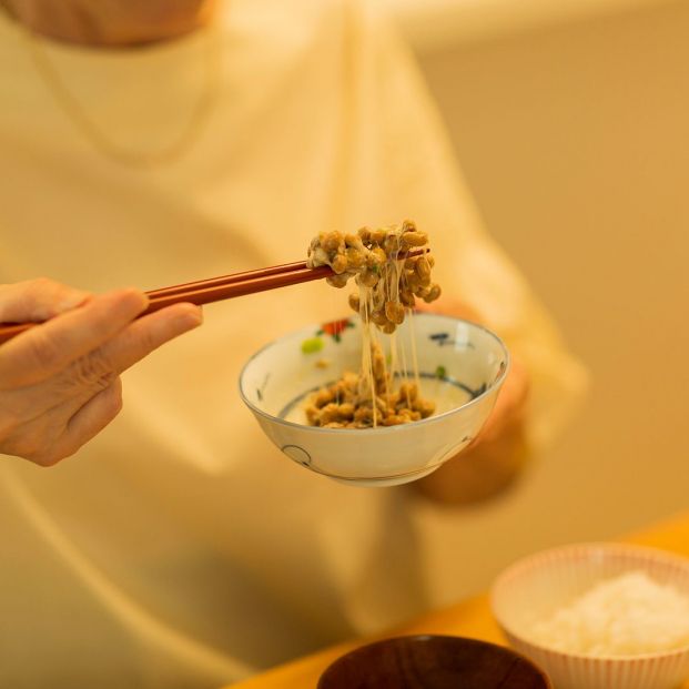 bigstock Senior woman eating natto at d 307056949