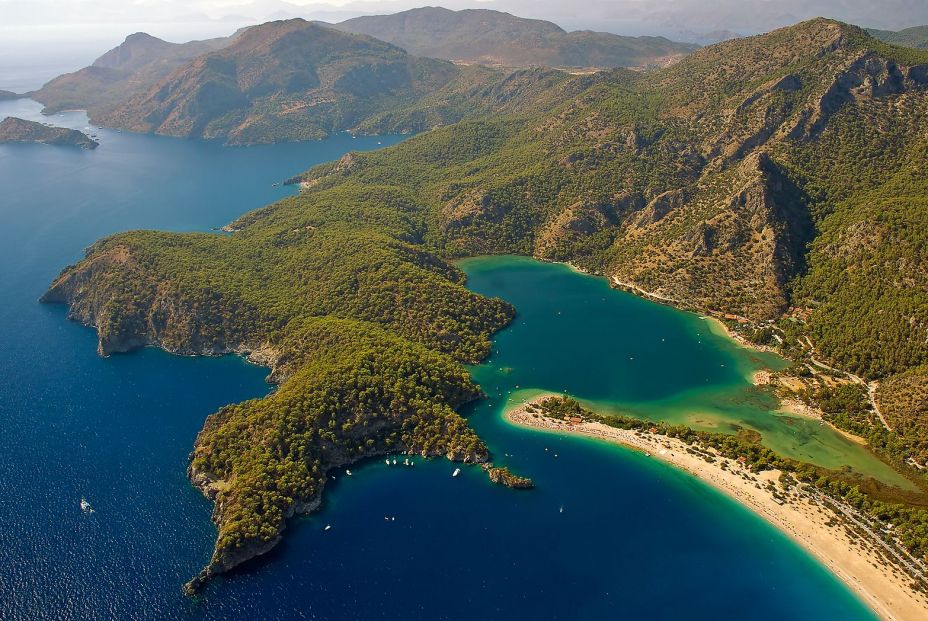 bigstock Paragliding over turquoise bay 25888244