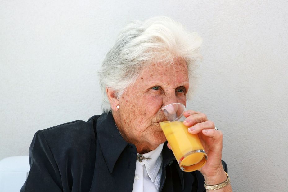 bigstock Old Lady Drinking Orange Juice 11780759