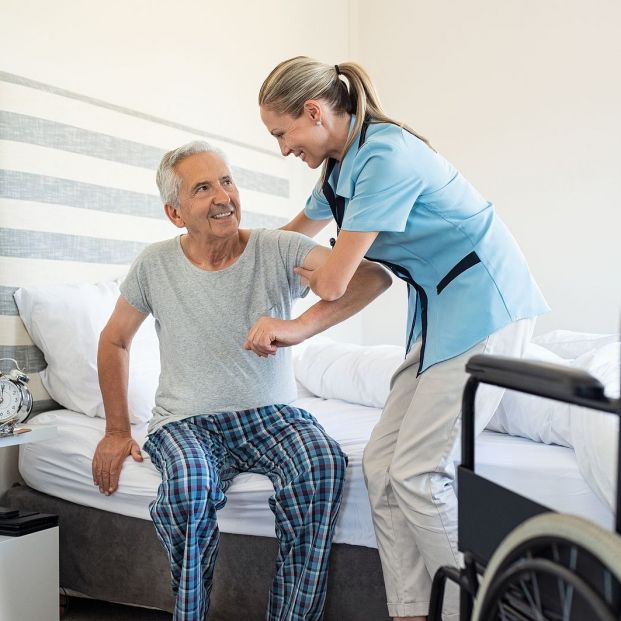 bigstock Smiling nurse assisting senior 259489606 bigstock Smiling nurse assisting senior 259489606