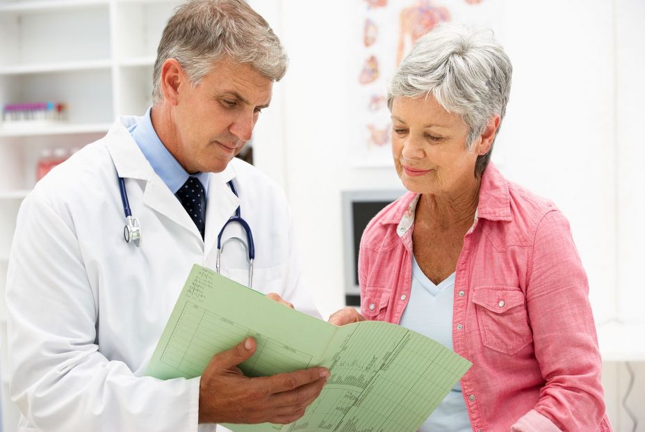 bigstock Doctor with female patient 21258452