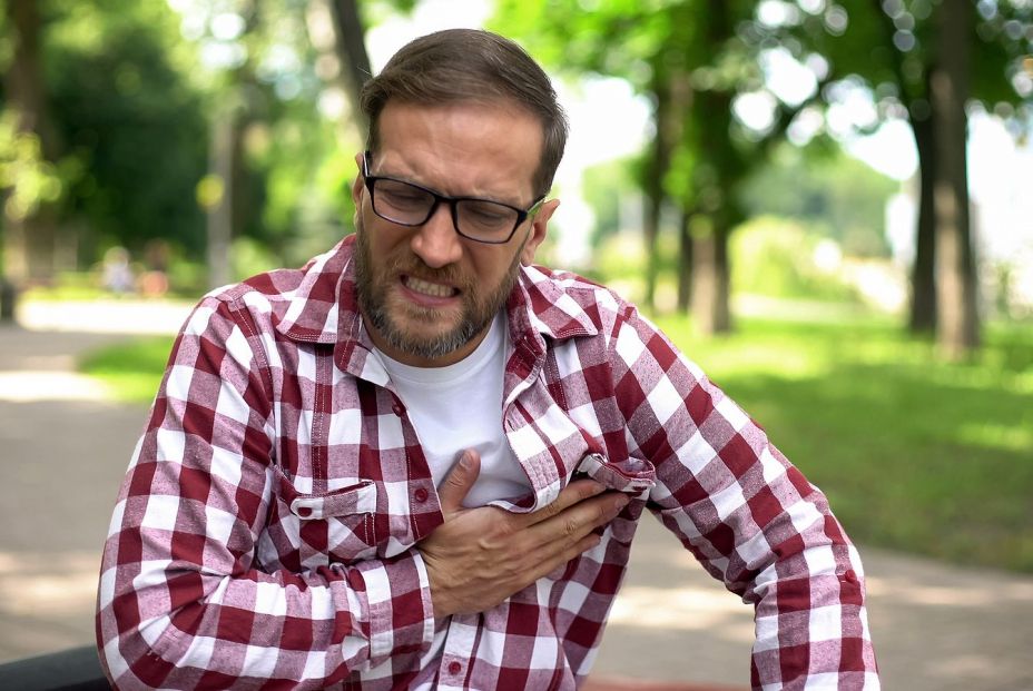 bigstock Male Feeling Chest Pain Sitti 348178462