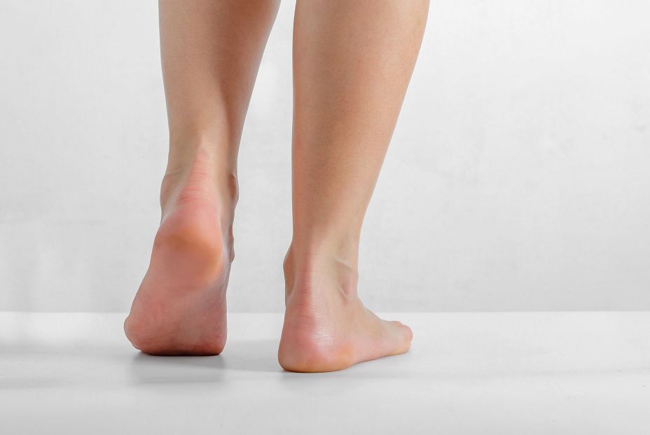 bigstock Female Feet Feet Stand On A W 313225837