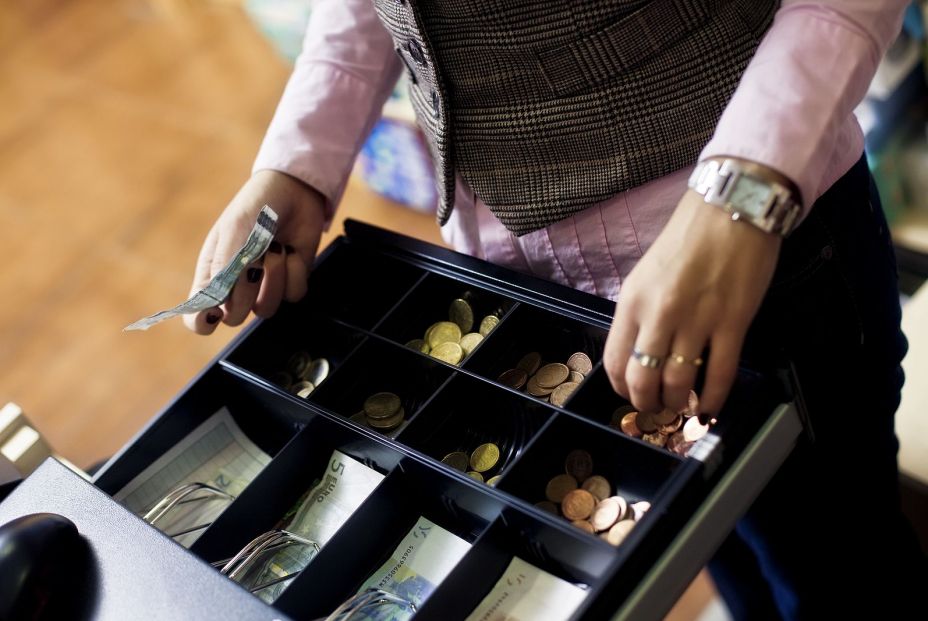 bigstock Woman hands on shop cash regis 28925639