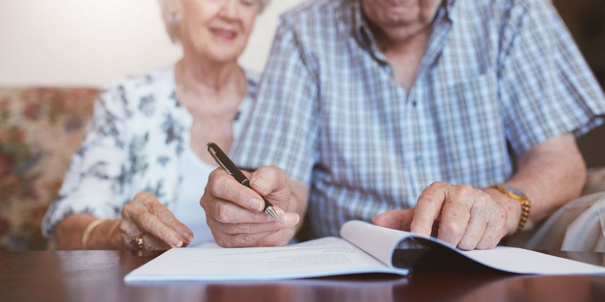 bigstock Senior Couple Signing Their Wi 131945624 bigstock Senior Couple Signing Their Wi 131945624