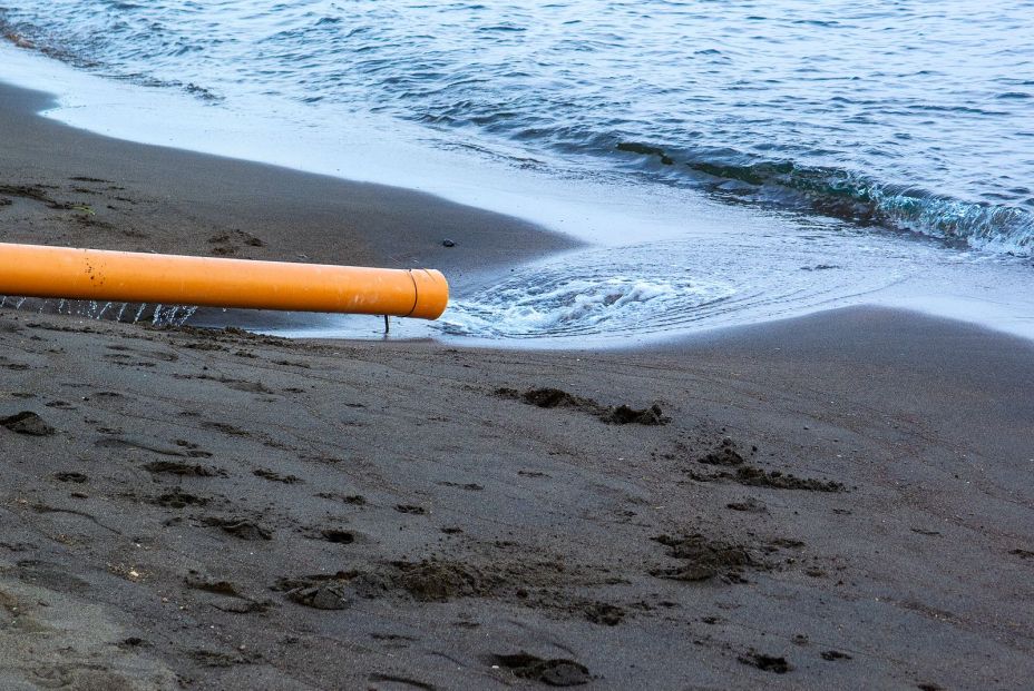 bigstock Orange Pipe With Water Poured324638917