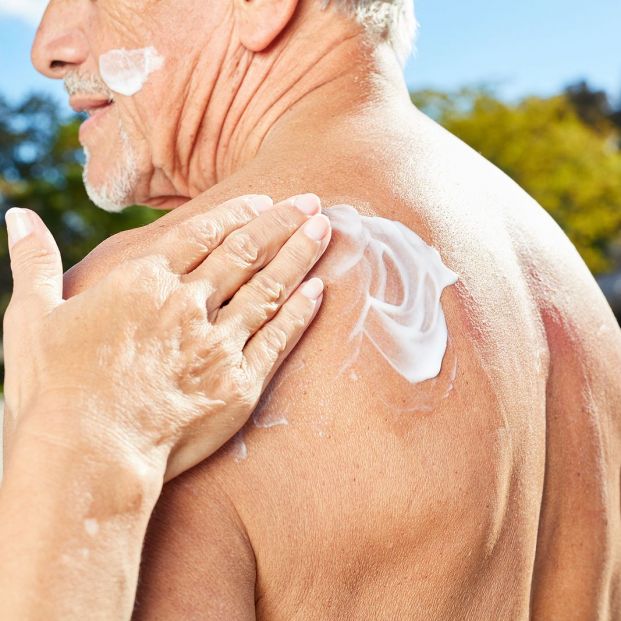 bigstock Woman rubs a man s back with s 326444914 bigstock Woman rubs a man s back with s 326444914