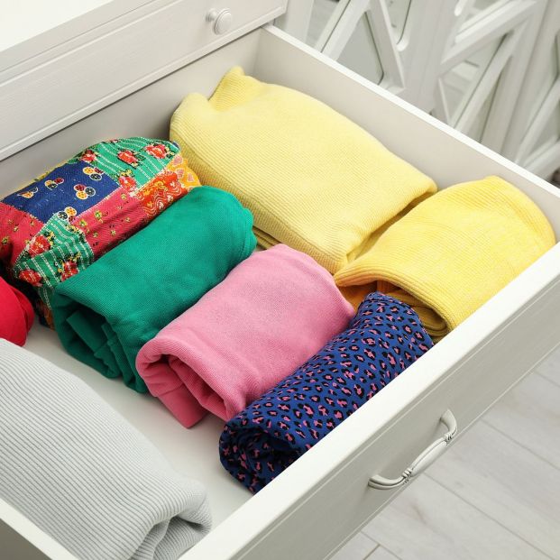 bigstock Folded Clothes In Open Drawer362057533