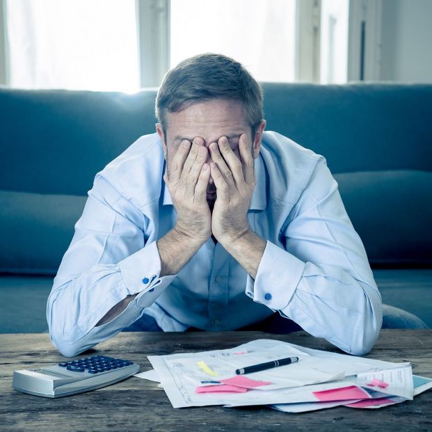 bigstock Upset Man In Stress Paying Bil 307334611