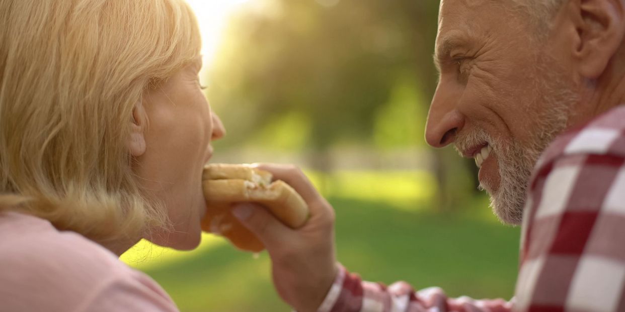 bigstock Elderly Man Feeding His Wife F 349879093