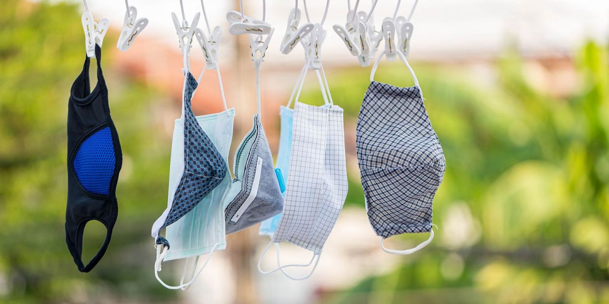 bigstock Wash the face mask and dry in364968451