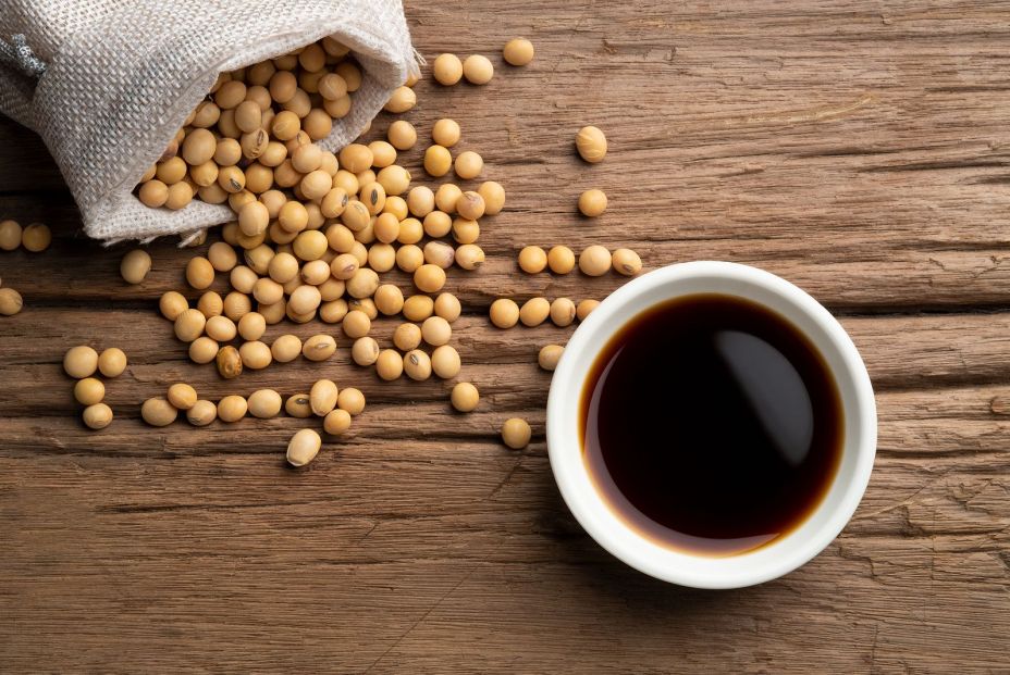 bigstock Soy Sauce And Soy Bean On Wood 392143595