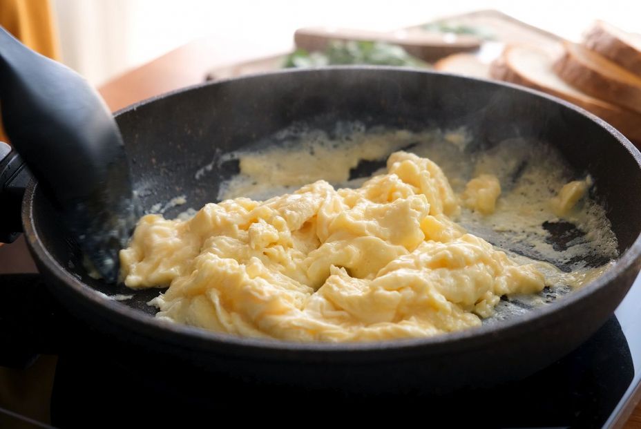 bigstock Scrambled Eggs In Cooking Pan384398342
