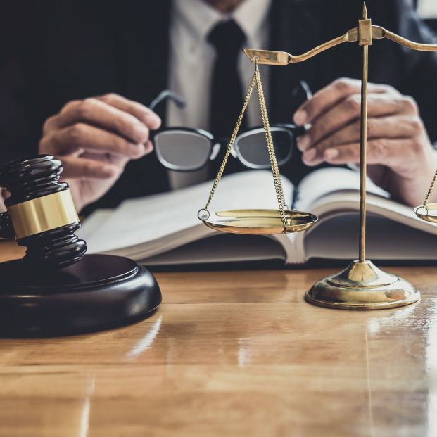 bigstock Male Lawyer Or Judge Working W 385610483