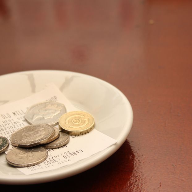 bigstock A Tip Left With A Paid Bill In 370377253